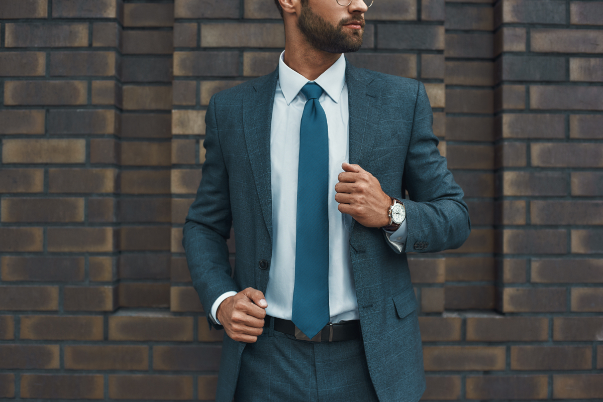 cropped-photo-of-a-businessman-in-full-suit-standi-2025-03-26-11-56-06-utc