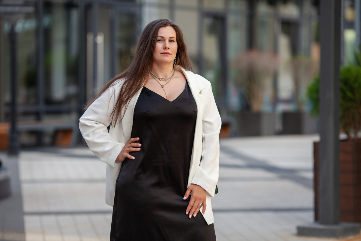 plus-size-stylish-woman-stands-outdoors-in-urban-s-2025-01-16-12-01-27-utc